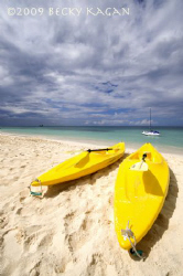 Our 2 Kayaks rest on the shoreline of Grand Cayman after ... by Becky Kagan 